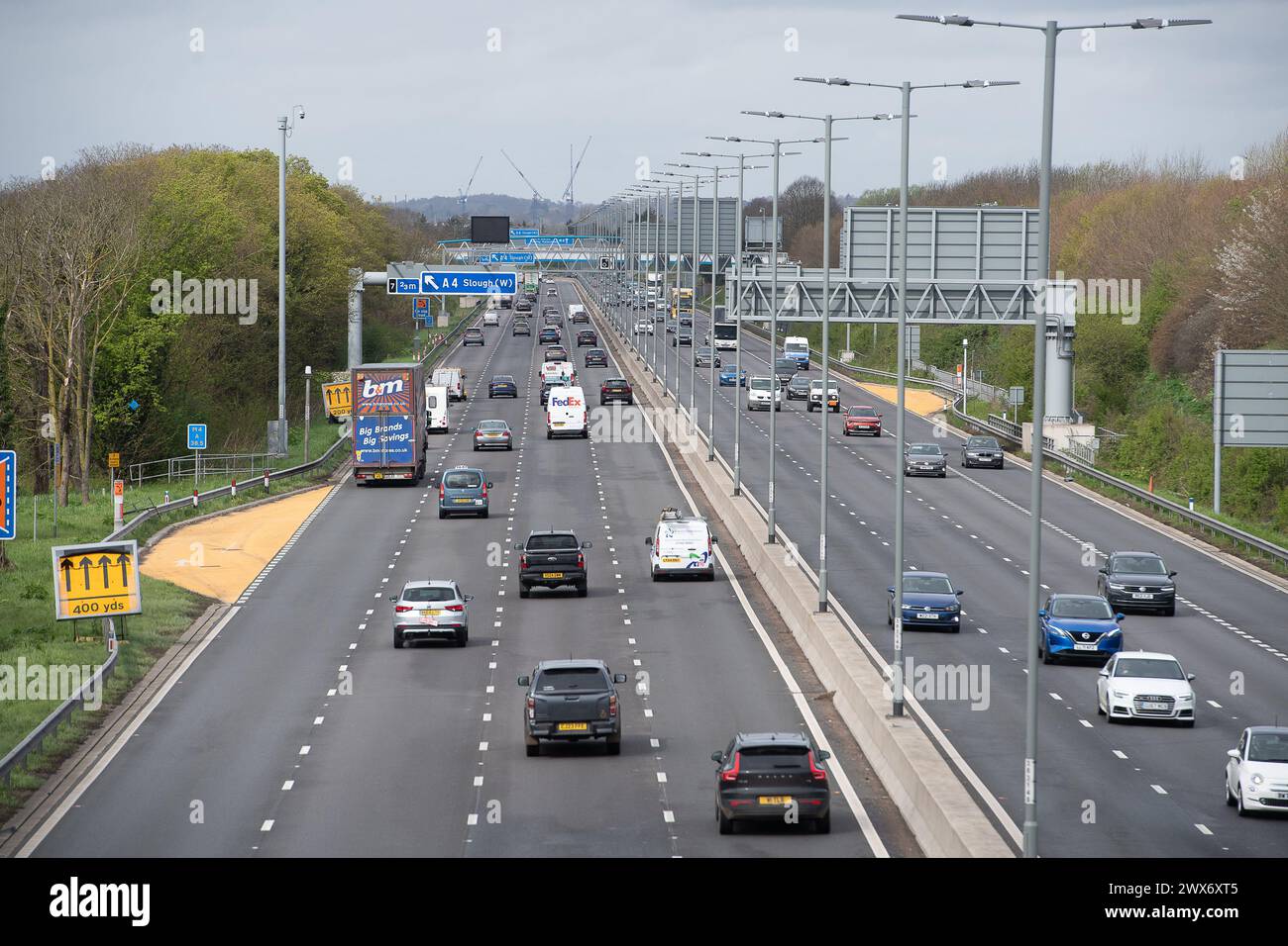 Slough, Berkshire, UK. 28th March, 2024. Traffic on the M4 Smart Motorway in Slough, Berkshire this morning before the rain started. Motorways are expected to get very busy over the Easter Bank Holiday Weekend as schools break up and people head off on holidays. Credit: Maureen McLean/Alamy Live News Stock Photo