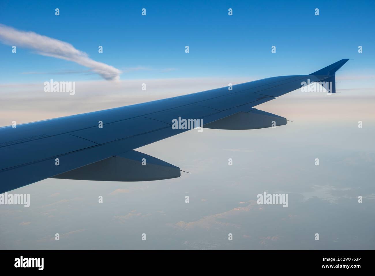 Flying above the clouds, chemtrail Stock Photo