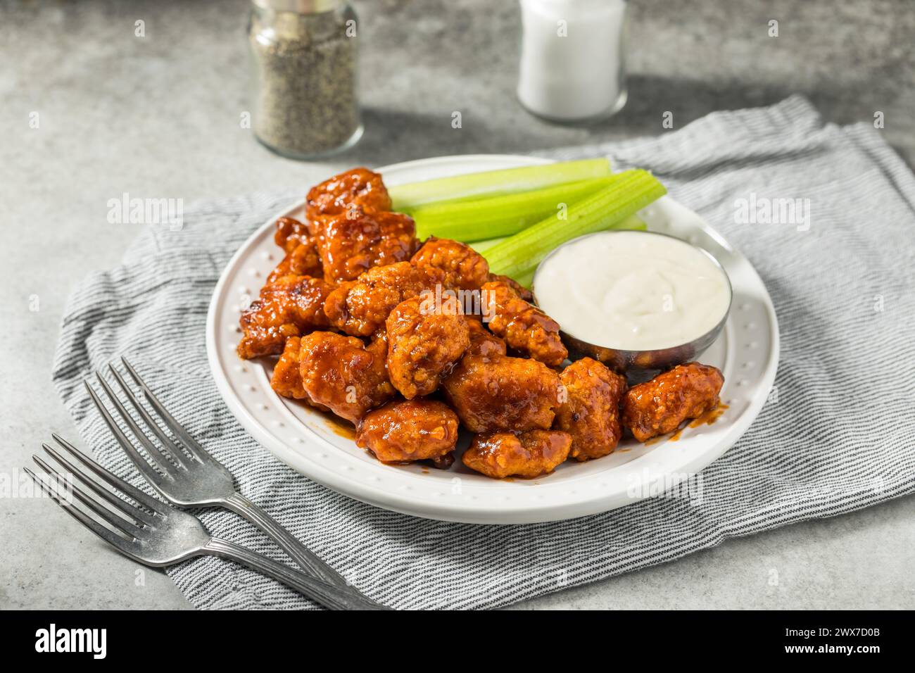 Spicy Boneless Barbecue Chicken Wings with Ranch and Celery Stock Photo