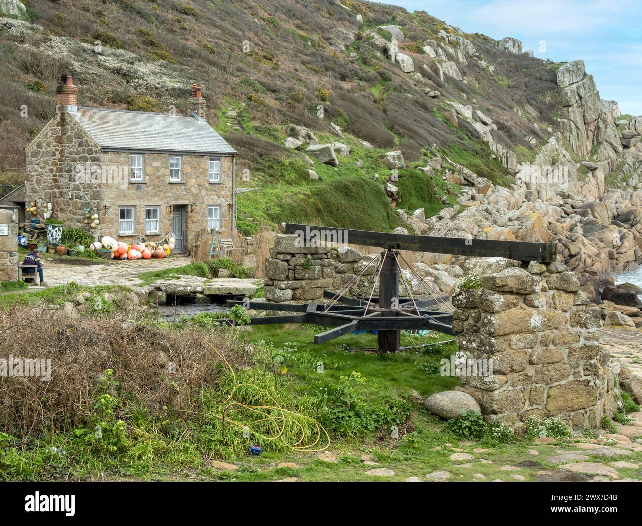Old capstan boat winch and Cornish granite cottage at Penberth Cove