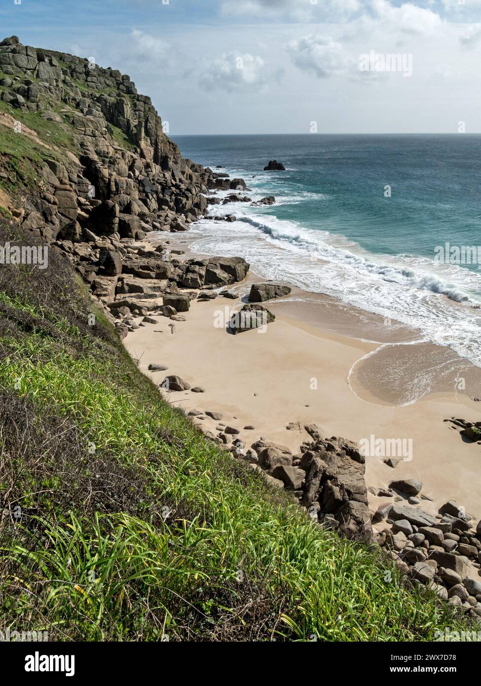 Small sandy beach at Porth Chapel Cove near Porthcurno, South Cornwall, England, UK Stock Photo