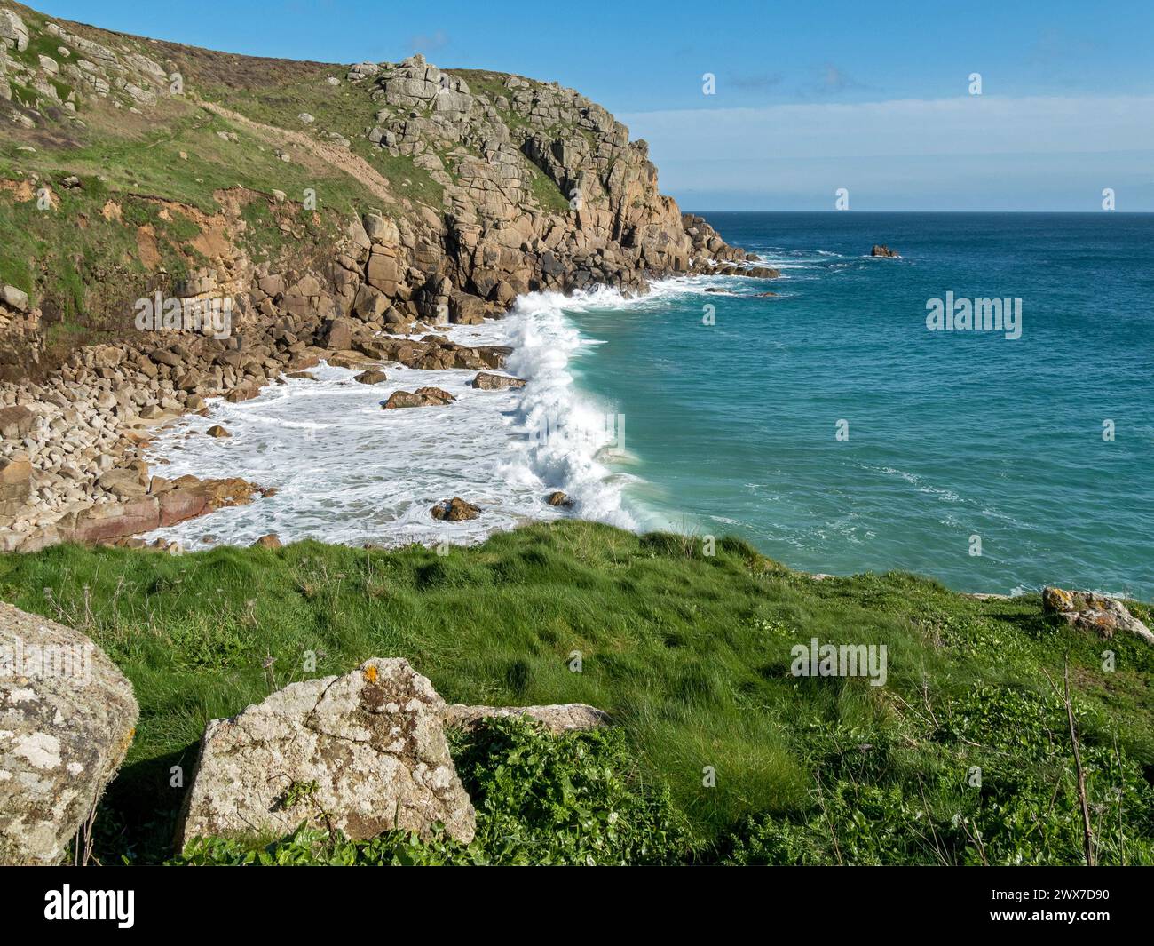 Waves and surf at Porth Chapel Cove near Porthcurno, South Cornwall, England, UK Stock Photo