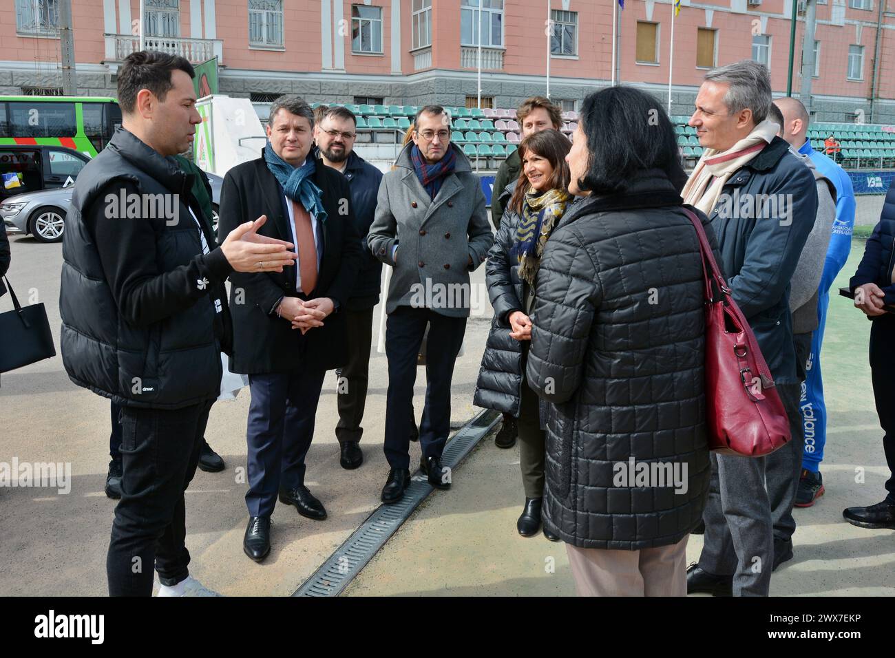 Kyiv, Ukraine. 28th Mar, 2024. The director of the club, Oleksandr Egorov, tells the mayor of Paris, Anne Hidalgo, about the tragic day on January 23, 2024, when a rocket hit the sports complex. The Mayor of Paris, Anne Hidalgo, visited Kyiv and visited FC Lokomotiv Kyiv, whose sports complex was damaged by a Russian missile attack on January 23, 2024. The mayor observed how the players of different age teams train on the field, and at the end took a joint photo with the football players. (Photo by Aleksandr Gusev/SOPA Images/Sipa USA) Credit: Sipa USA/Alamy Live News Stock Photo