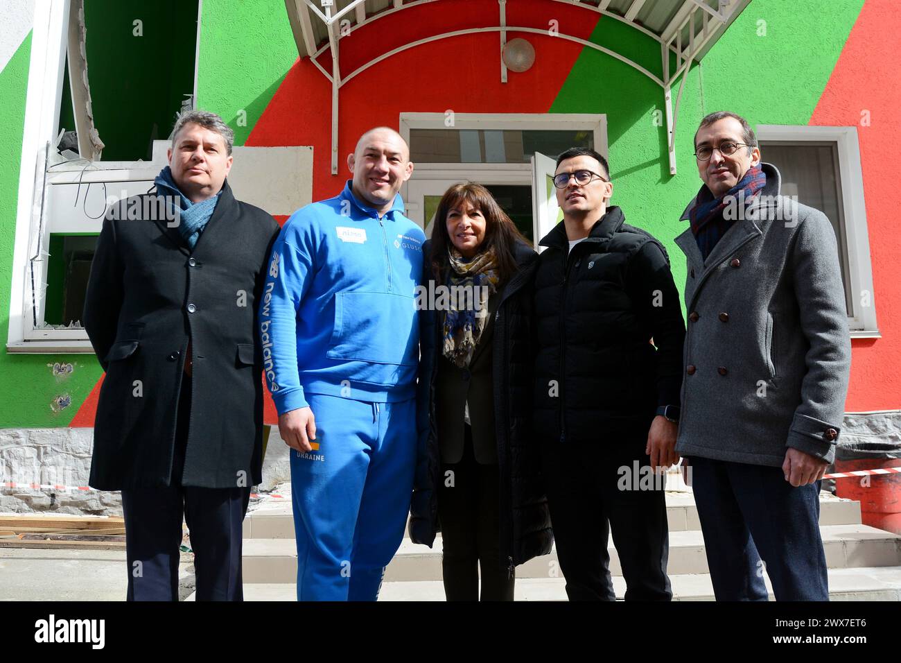Mayor of Paris Anne Hidalgo (C) during a visit to the sports complex of FC Lokomotiv Kyiv, which was damaged by a Russian missile attack on January 23, 2024. The Mayor of Paris, Anne Hidalgo, visited Kyiv and visited FC Lokomotiv Kyiv, whose sports complex was damaged by a Russian missile attack on January 23, 2024. The mayor observed how the players of different age teams train on the field, and at the end took a joint photo with the football players. (Photo by Aleksandr Gusev / SOPA Images/Sipa USA) Stock Photo