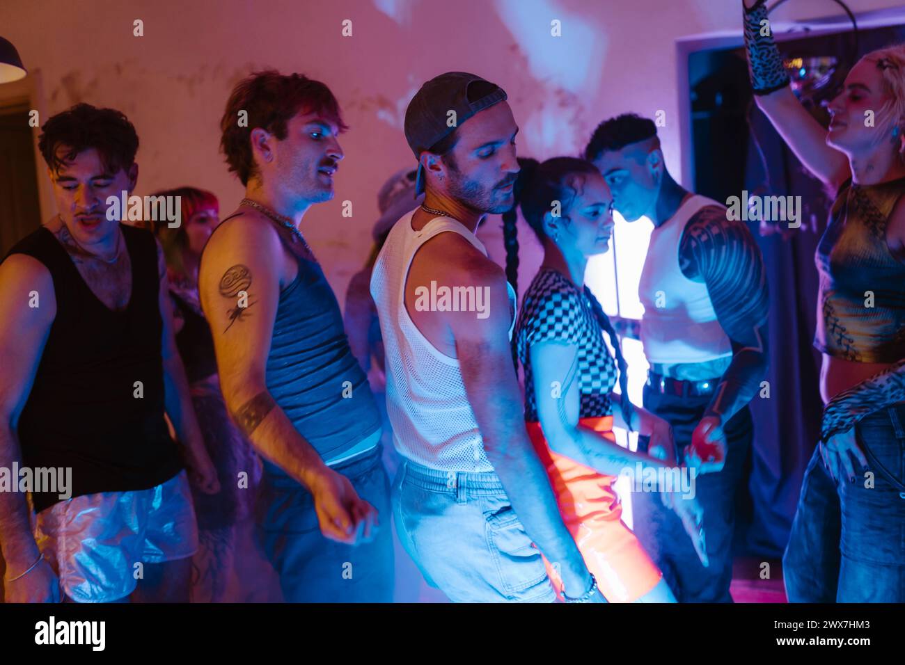 Group of multiracial non-binary friends clubbing at nightclub Stock ...