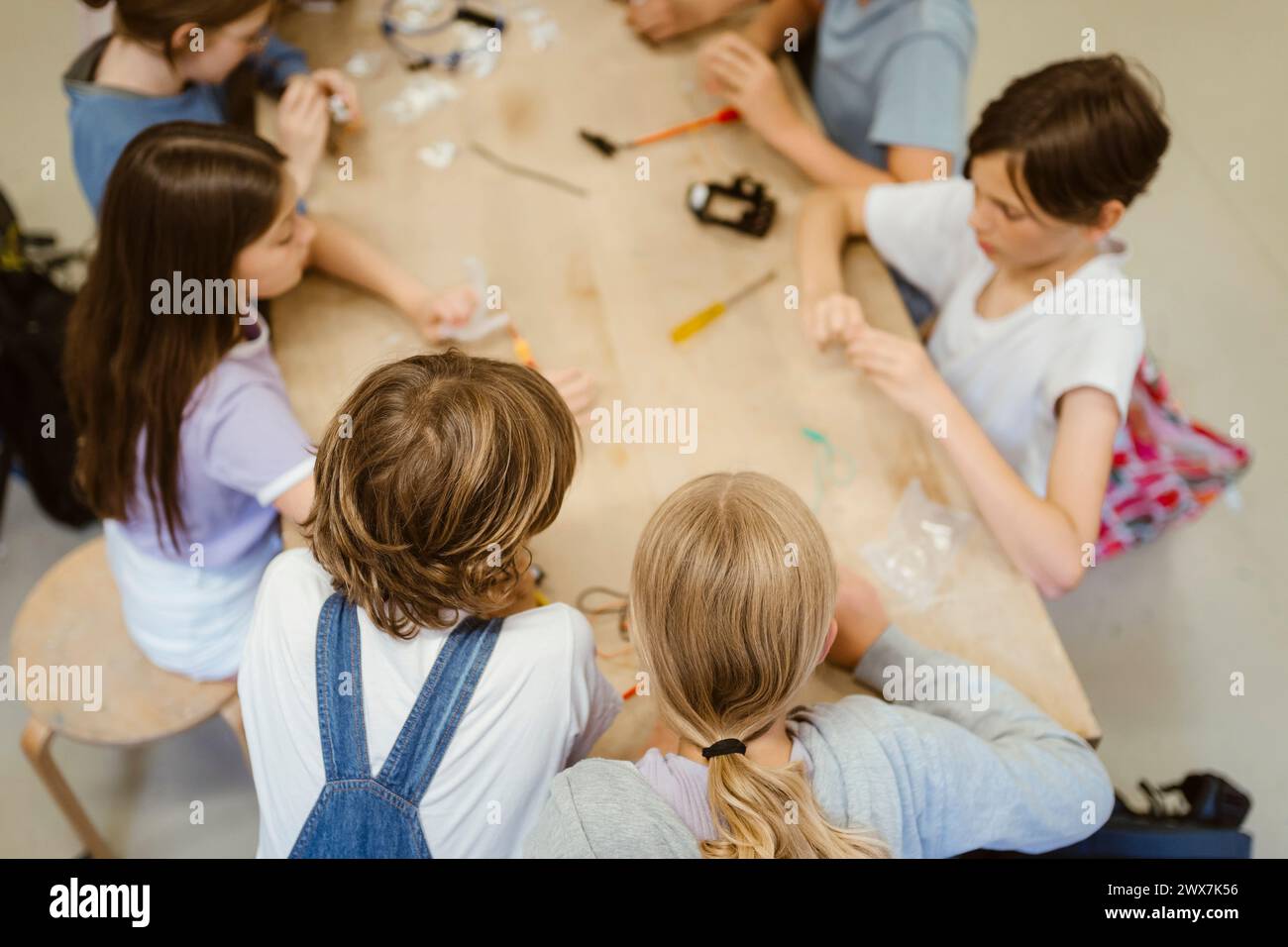 High angle view of male and female students working on robotics project at school Stock Photo