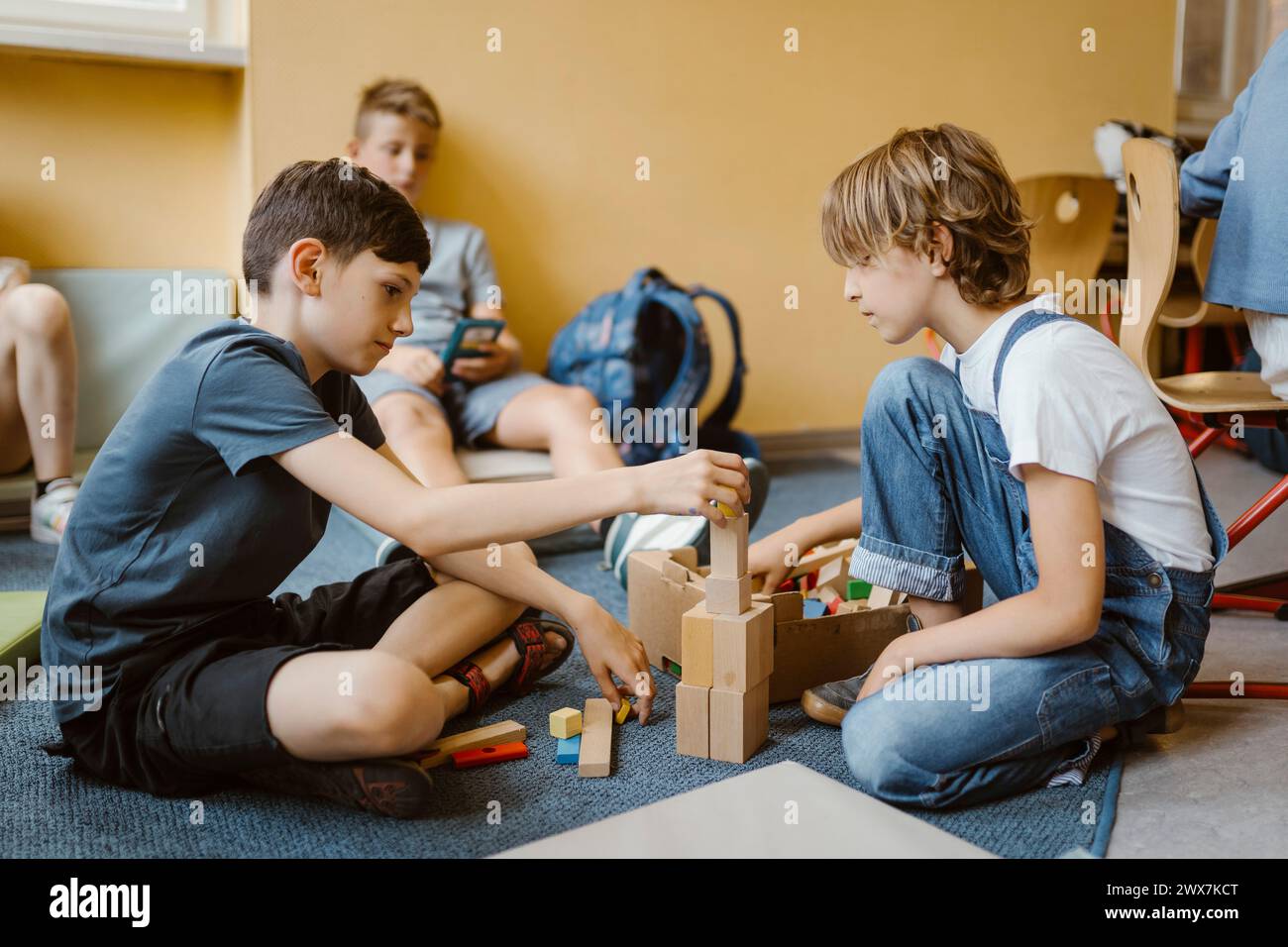 Female child sitting on hi-res stock photography and images - Alamy