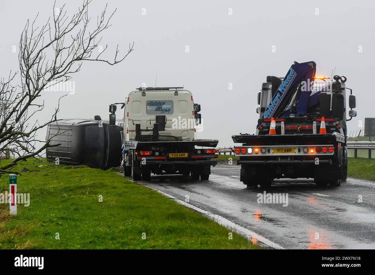 Litton Cheney, Dorset, UK. 28th March 2024. UK Weather. A van towing a
