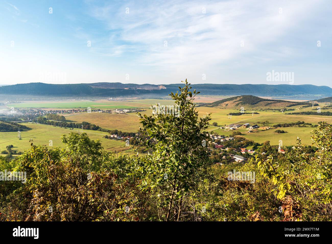 Countryside with mountain ridge of Dolny vrch on slovakian - hungarian borderlands above - view above Zadiel village in Slovensky kras national park d Stock Photo