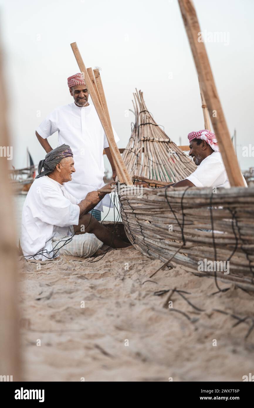 Dhow wooden boat maker. constructing dhow boat. Stock Photo