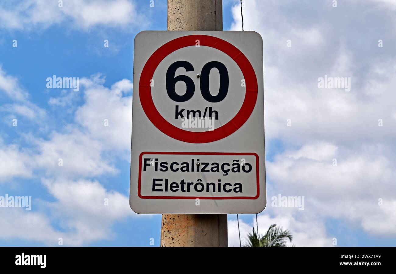 Traffic sign speed limit at 60 kilometers per hour and information in portuguese saying: electronic inspection Stock Photo