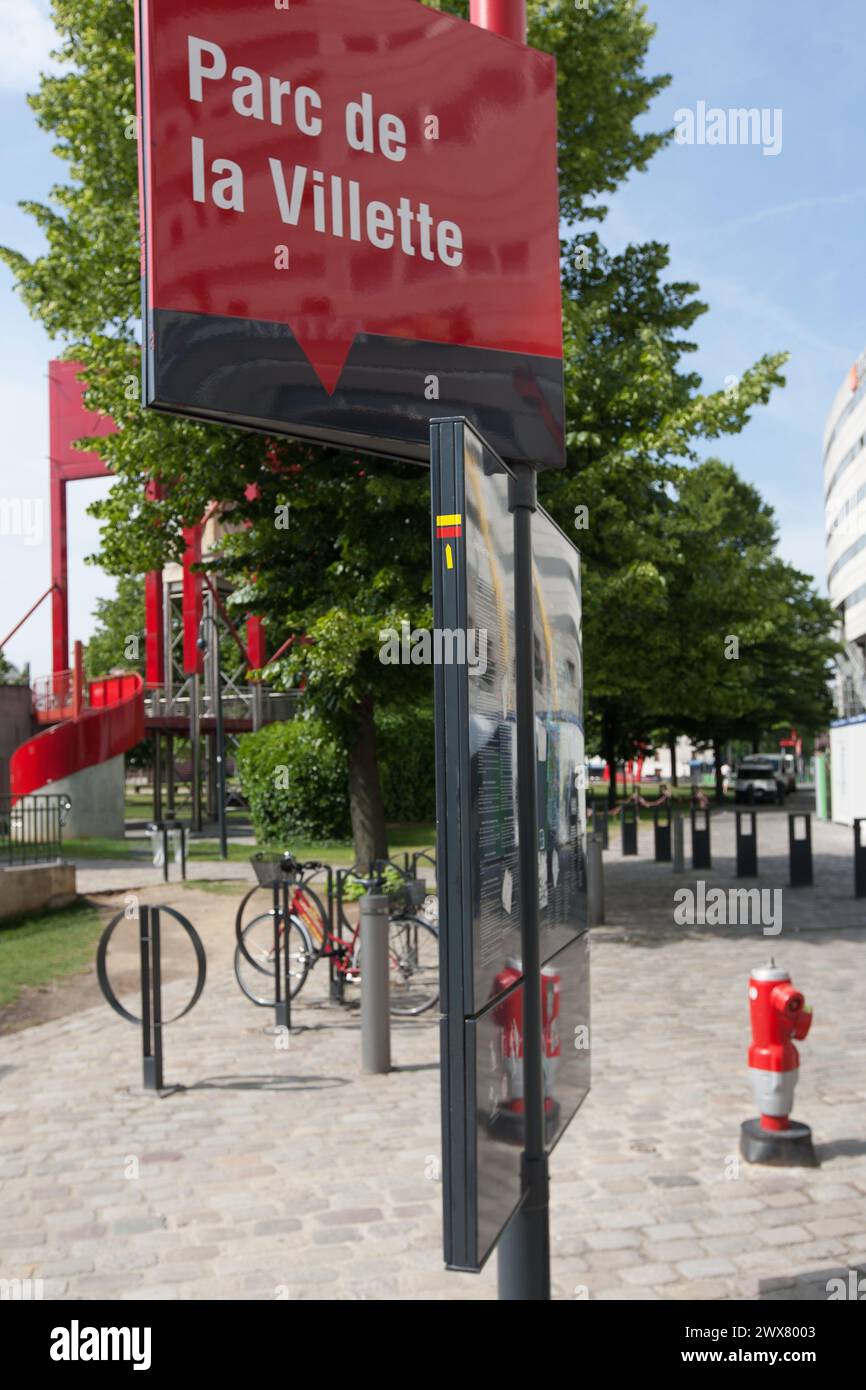 Parc De La Villette, Paris. In the background, one of the 'Folies', red construction built like the playful constructions of 18th-century parks and gardens. Stock Photo