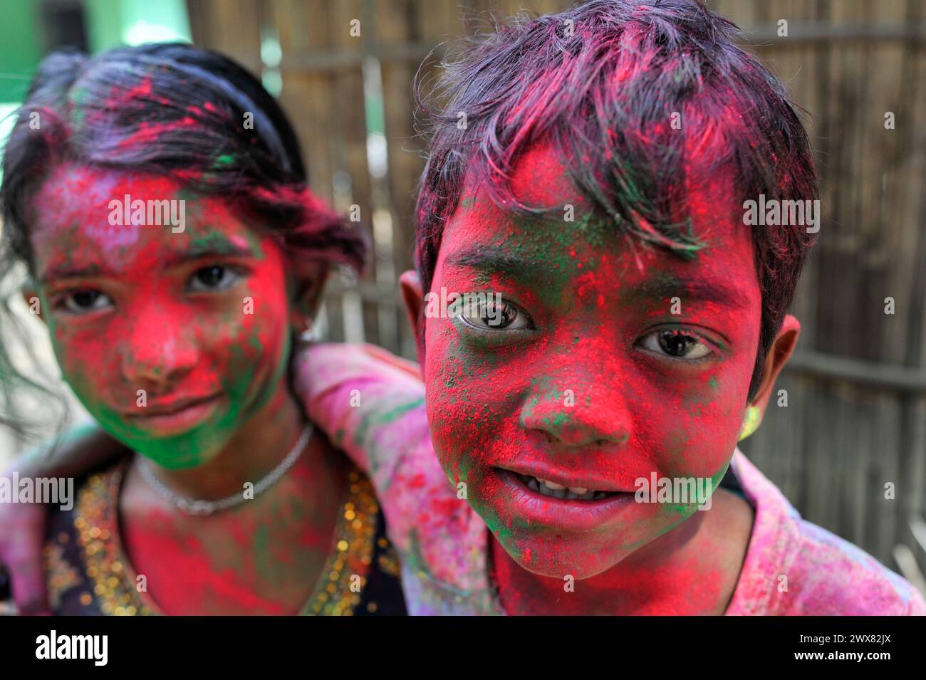 Sylhet, Bangladesh. 26th Mar, 2024. March 26, 2024, Sylhet, Bangladesh: Children portrait with their faces painted with colored powder celebrating the annual Hindu festival of colors, known as Holi festival, marking the onset of spring. on March 26, 2024, Sylhet, Bangladesh. (Photo by Md Rafayat Haque Khan/ Eyepix Group/Sipa USA) Credit: Sipa USA/Alamy Live News Stock Photo