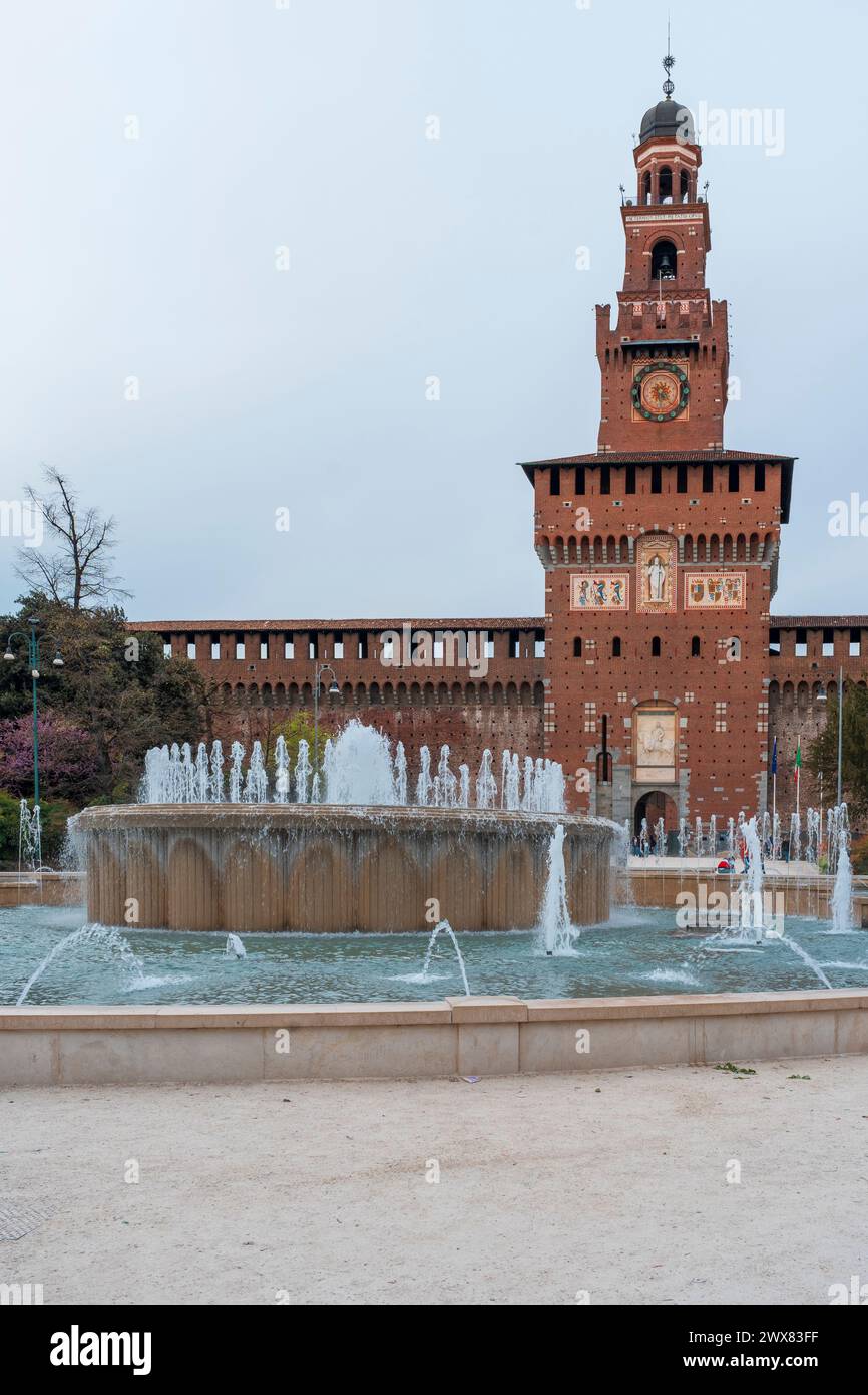 Main Entrance To The Sforza Castle Sforzesco Castle And Fountain In Front Of It Overcast Day