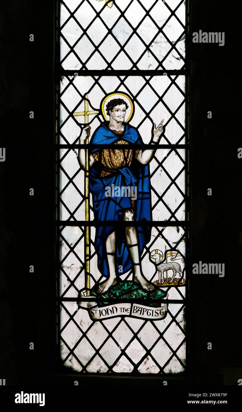 Stained Glass Window Of Saint John The Baptist With Sheep, Church Of Saint Thomas The Apostle, Lymington, UK Stock Photo