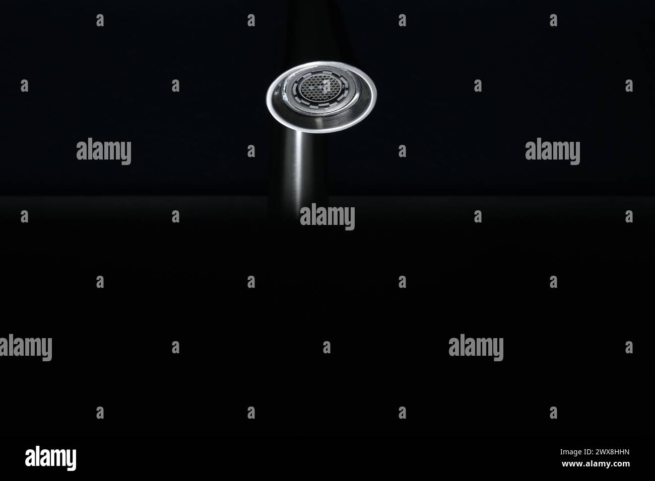 Bathroom faucet in a dark room, part of bathroom sink water faucet Stock Photo