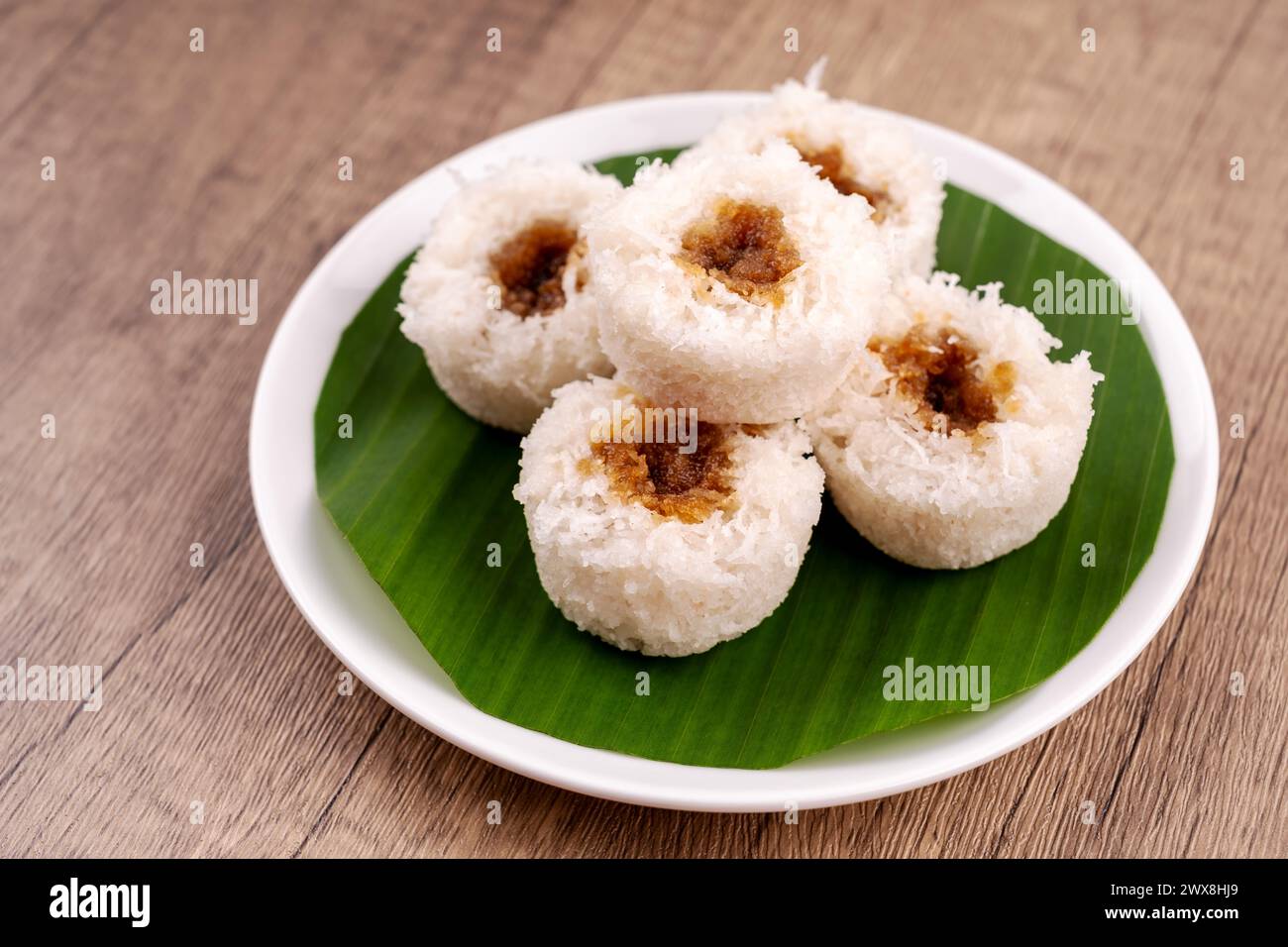 Putu bambu or steamed rice flour cake with grated coconut and palm sugar filling Stock Photo