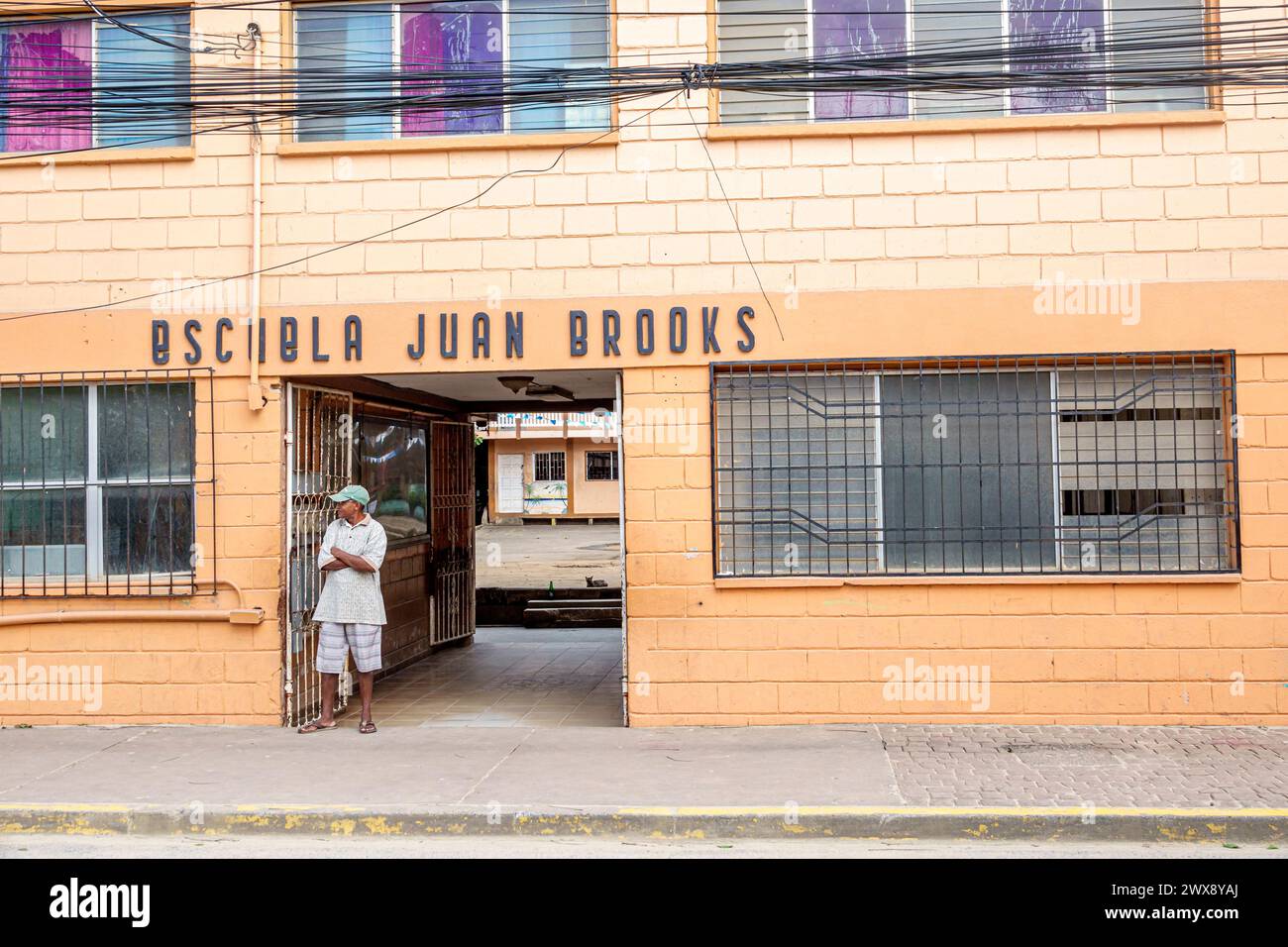 Port Roatan Honduras,Coxen Hole,Bay Islands,Main Street,Escuela Juan Brooks school,outside exterior front entrance,Black Blacks African,ethnic ethnici Stock Photo