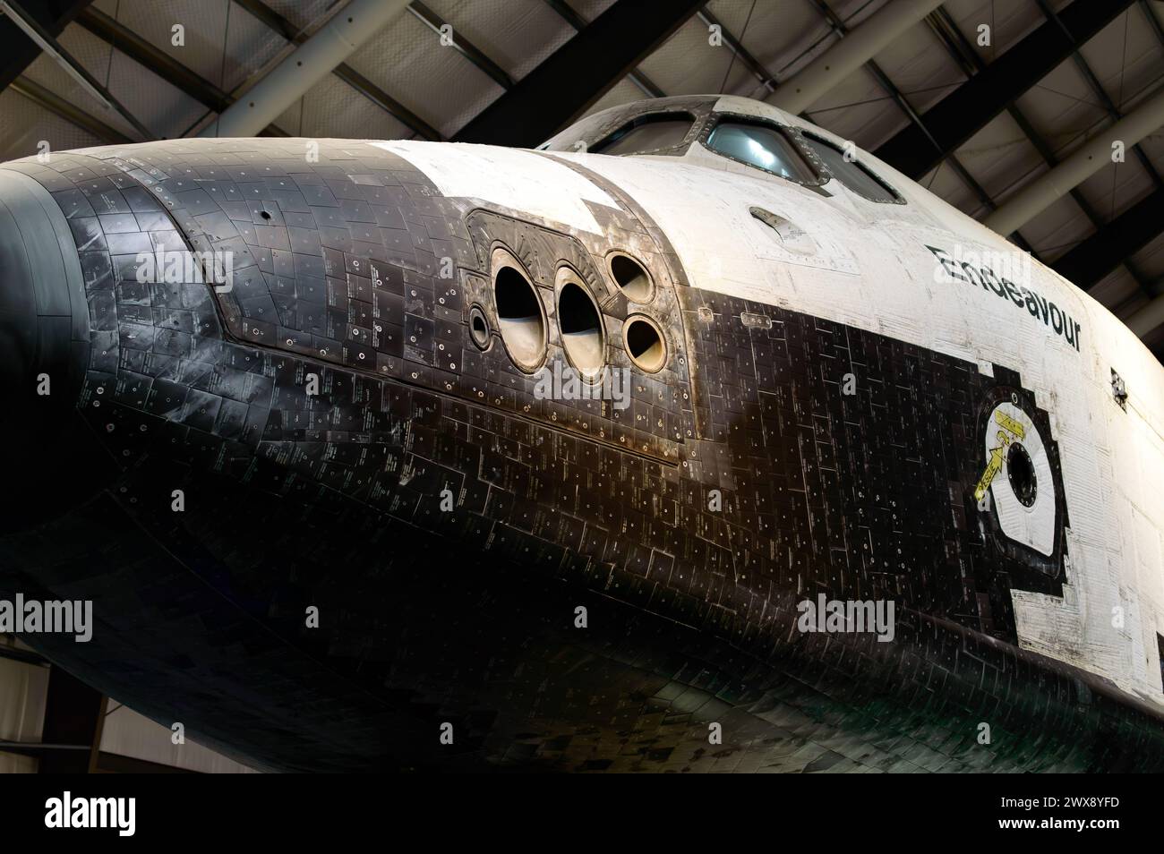 Side view from front of Space Shuttle Endeavour horizontally displayed at the California Science Center. Credit: Erik Morgan Stock Photo