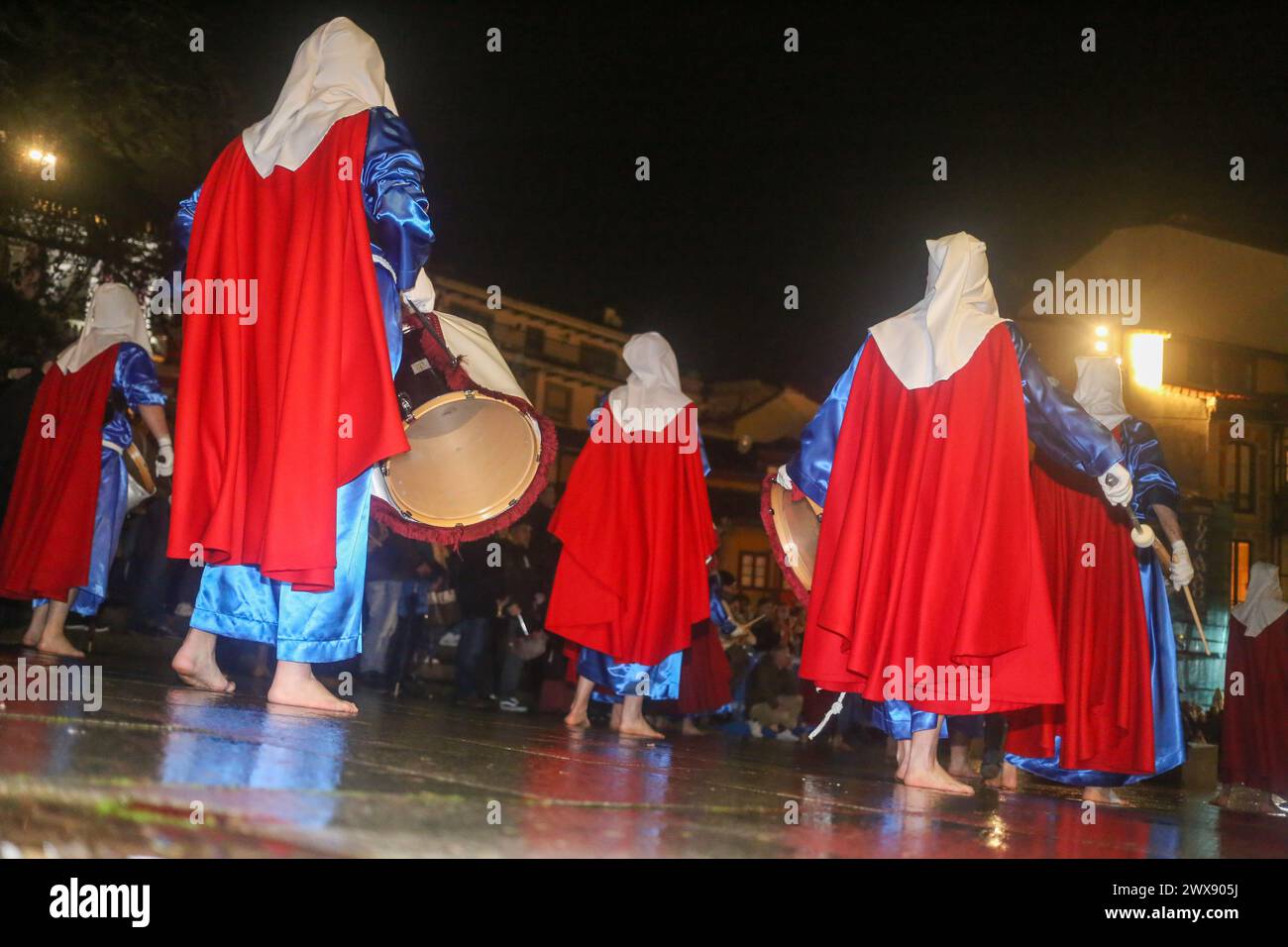 Avilés, Spain, March 28, 2024: The music band of the Brotherhood of San Juan Evangelista playing during the Procession of Silence, on March 28, 2024, in Avilés, Spain. Credit: Alberto Brevers / Alamy Live News. Stock Photo