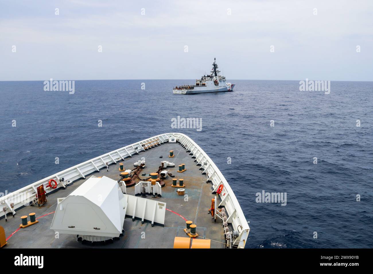 The Coast Guard cutters Hamilton (WMSL 753) and Munro (WMSL 755) conduct at-sea training in the Pacific Ocean, March 12, 2024. Hamilton and Munro exchanged cutter boats and sailed in formation during this evolution. (U.S. Coast Guard photo by Ensign Ray Corniel) Stock Photo