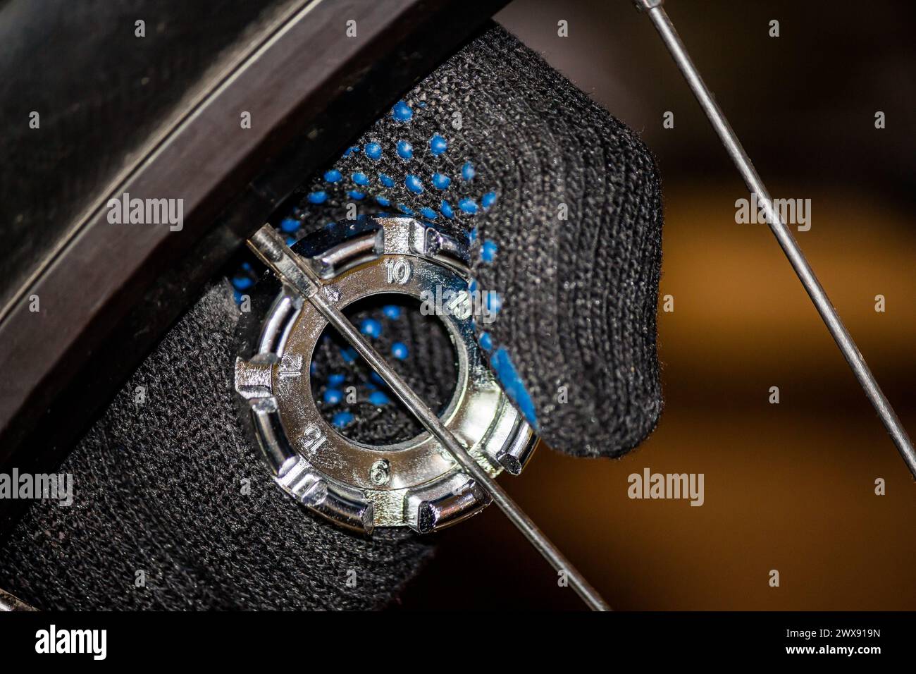 Bicycle repair. Adjust the tension of the spokes on the wheel of the