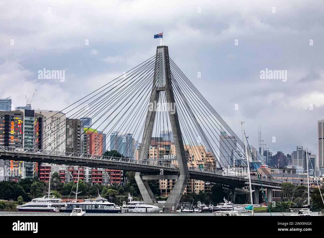 Anzac Bridge in Sydney, australian flag flying, bridge spans between Payment and Glebe and carries vehicular traffic on the Western Distributor Stock Photo