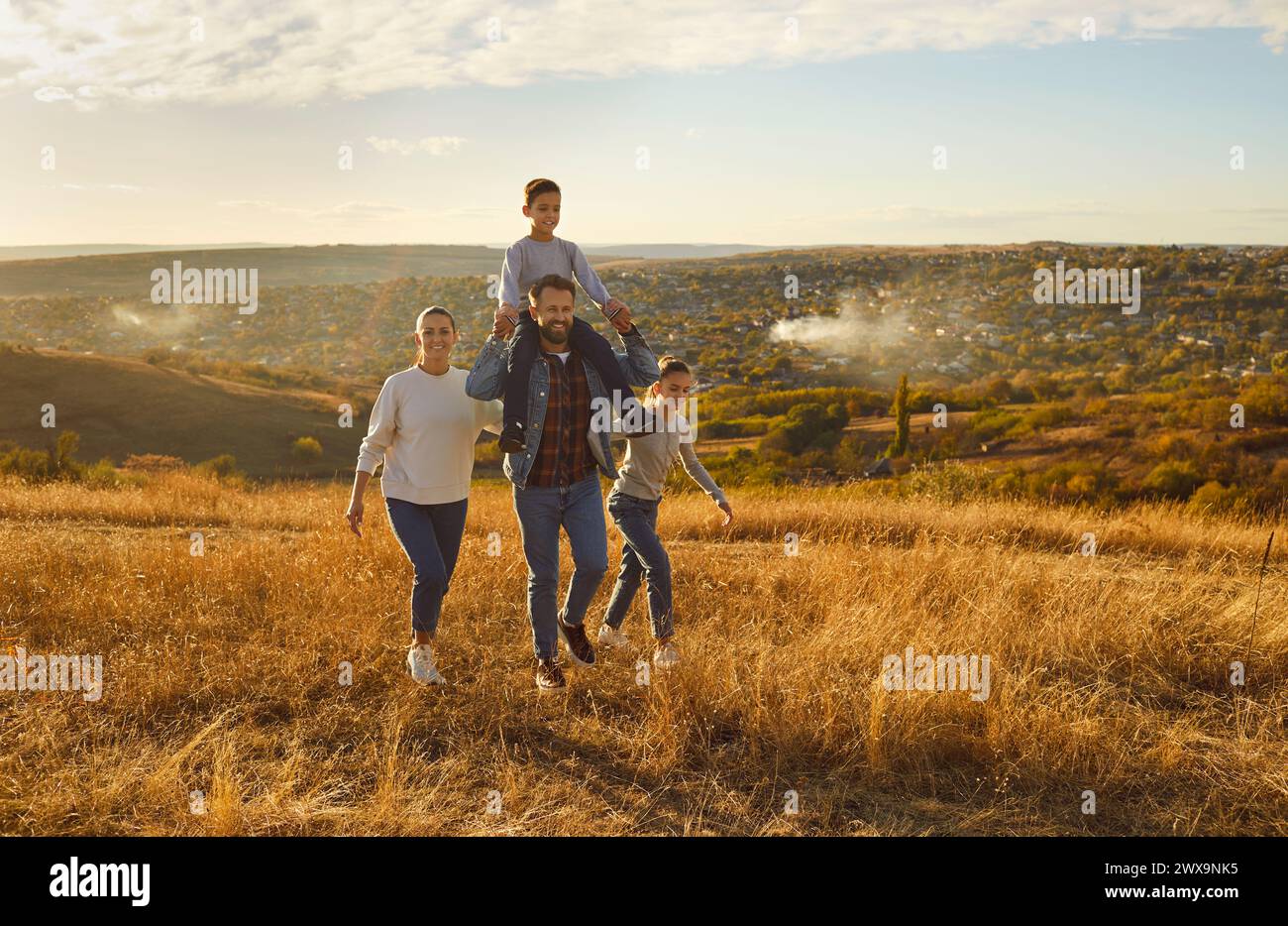 Happy family nature outdoor trip, spend weekend holiday together, parents, children enjoy good time Stock Photo