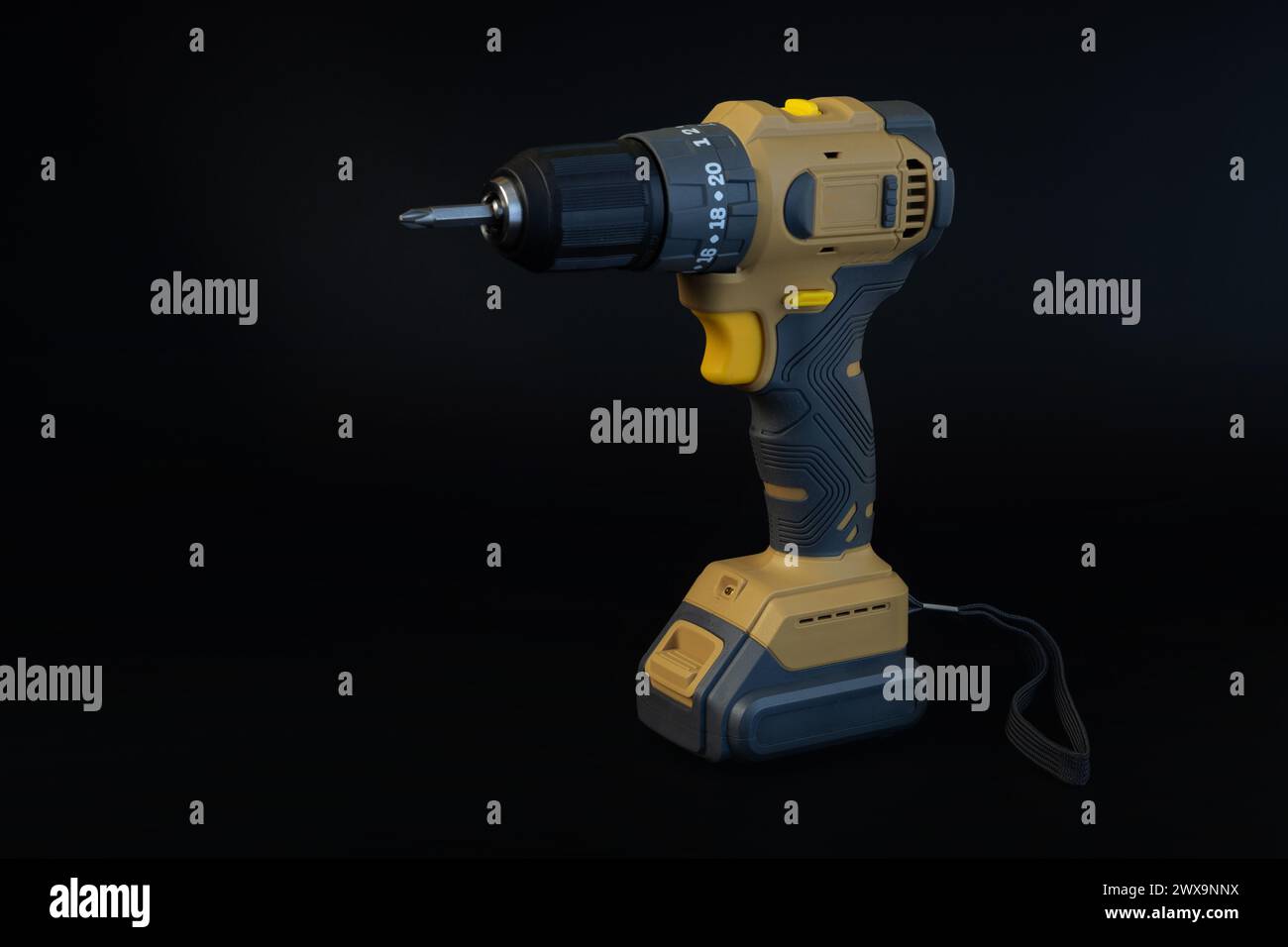 Cordless brushless screwdriver on black background. Stock Photo