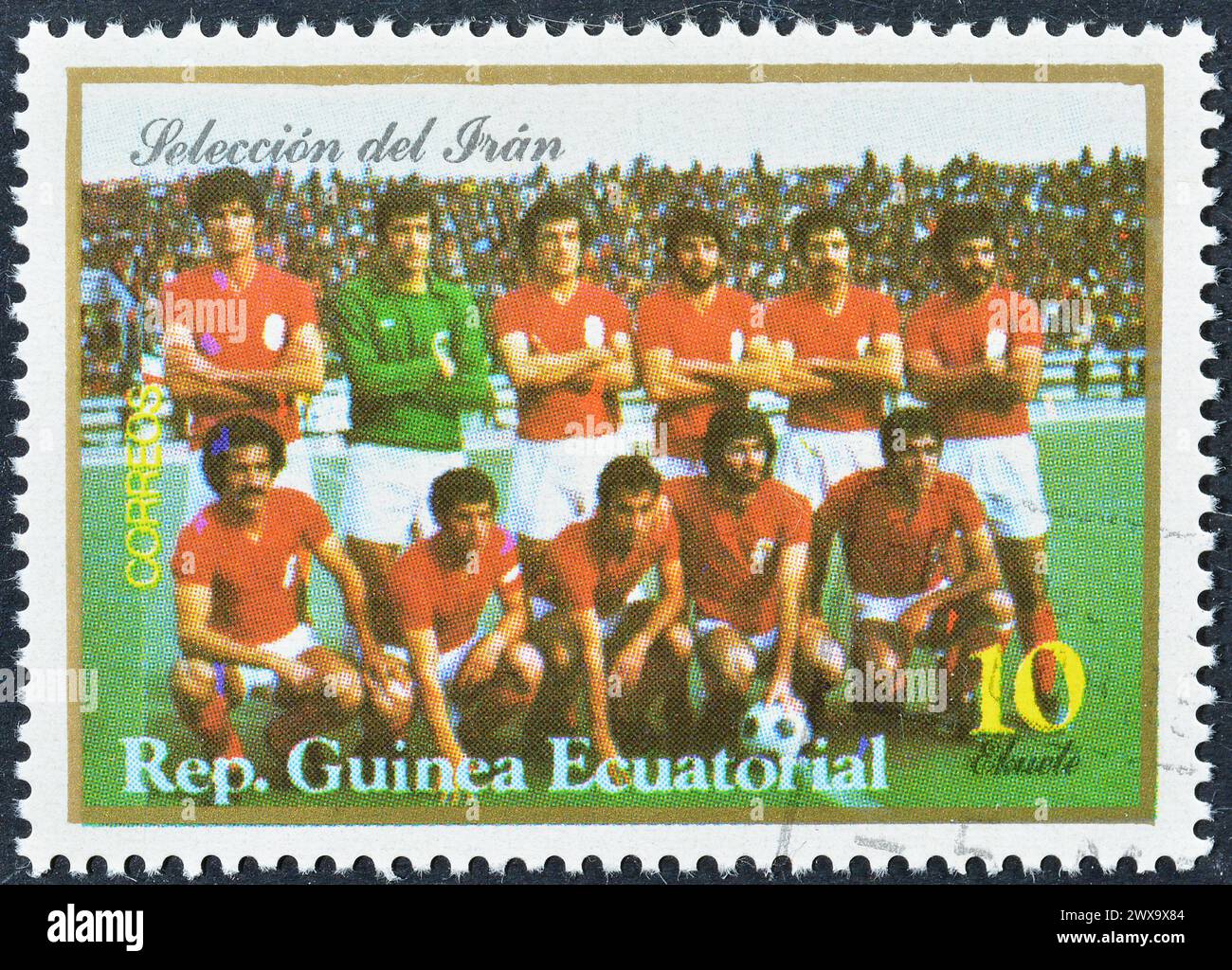 Cancelled postage stamp printed by Equatorial Guinea, that shows Iran football team, circa 1977. Stock Photo