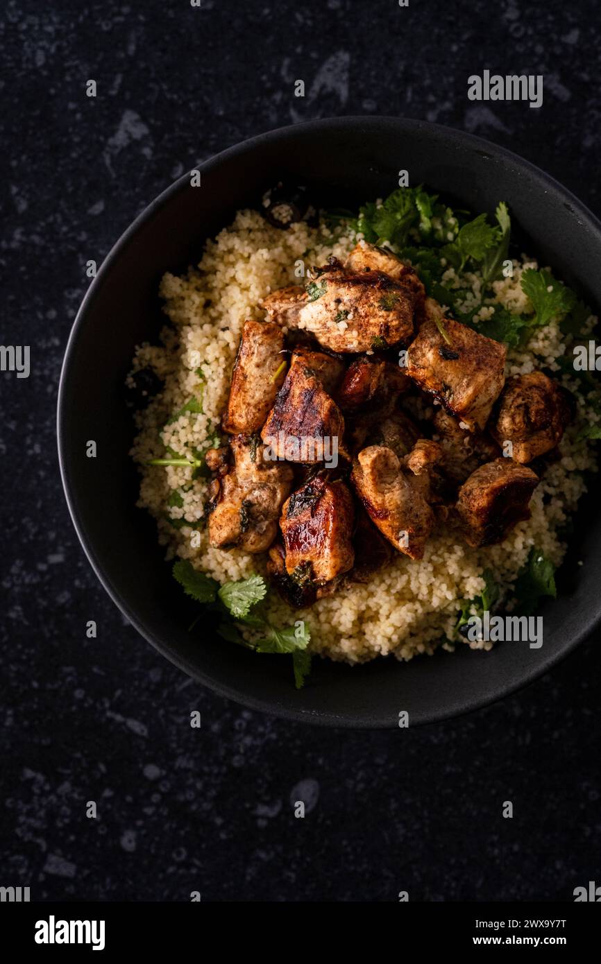 Chicken with lemon and coriander cous cous Stock Photo Alamy
