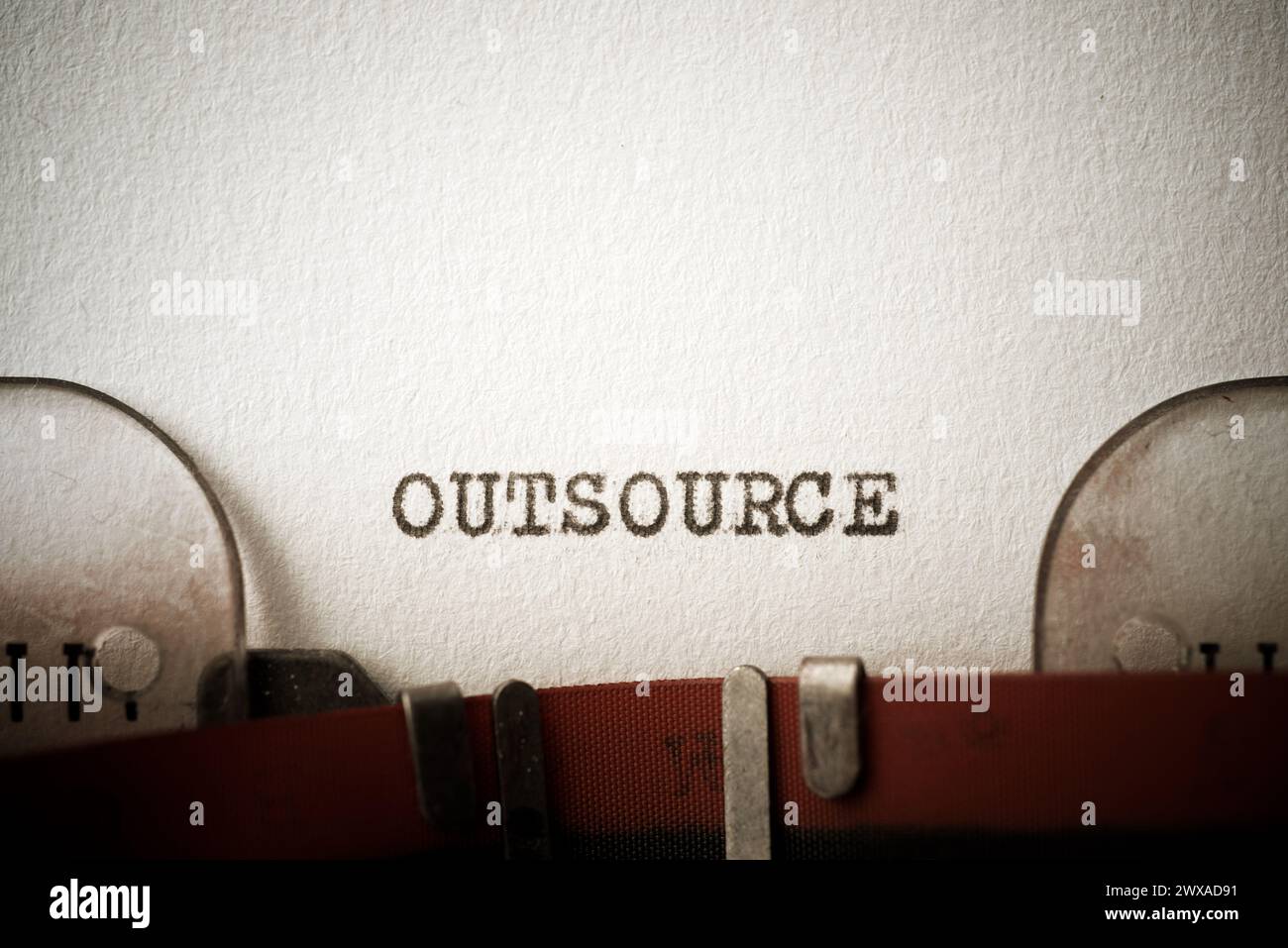Outsource word written with a typewriter. Stock Photo