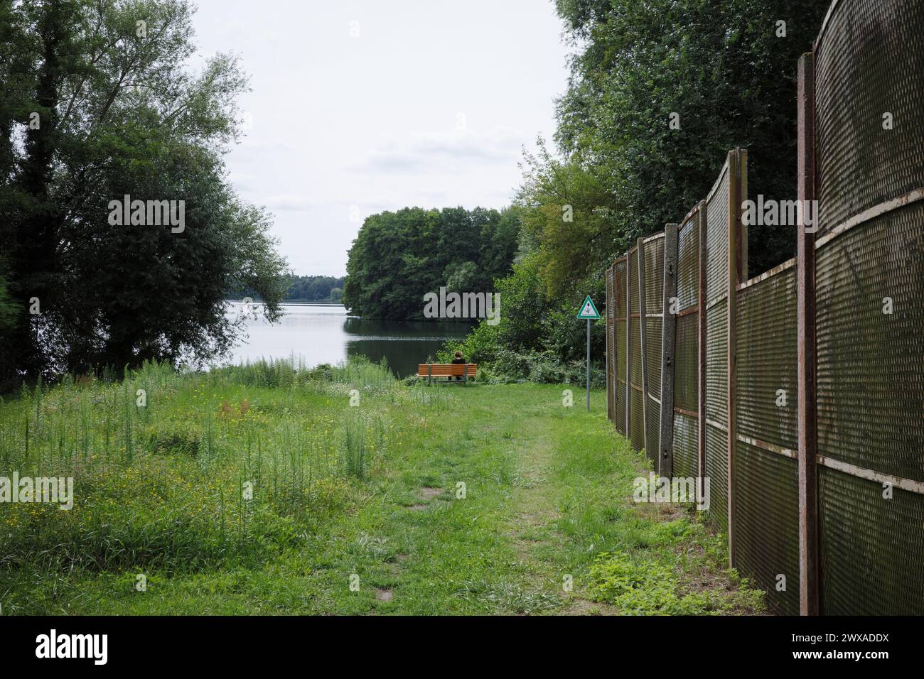 Berlin. Germany. Remains of the Berlin Wall at Gutspark on the Gross Glienicke Lake on the former East German/West Berlin border. Stock Photo