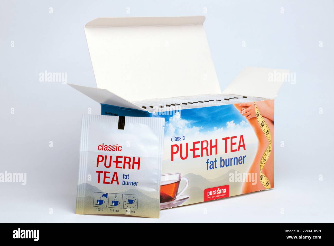Box of Pu-erh classic  tea  fermented green tea with enriched herbs goldenrod and rosemary  - 20 sachets Stock Photo
