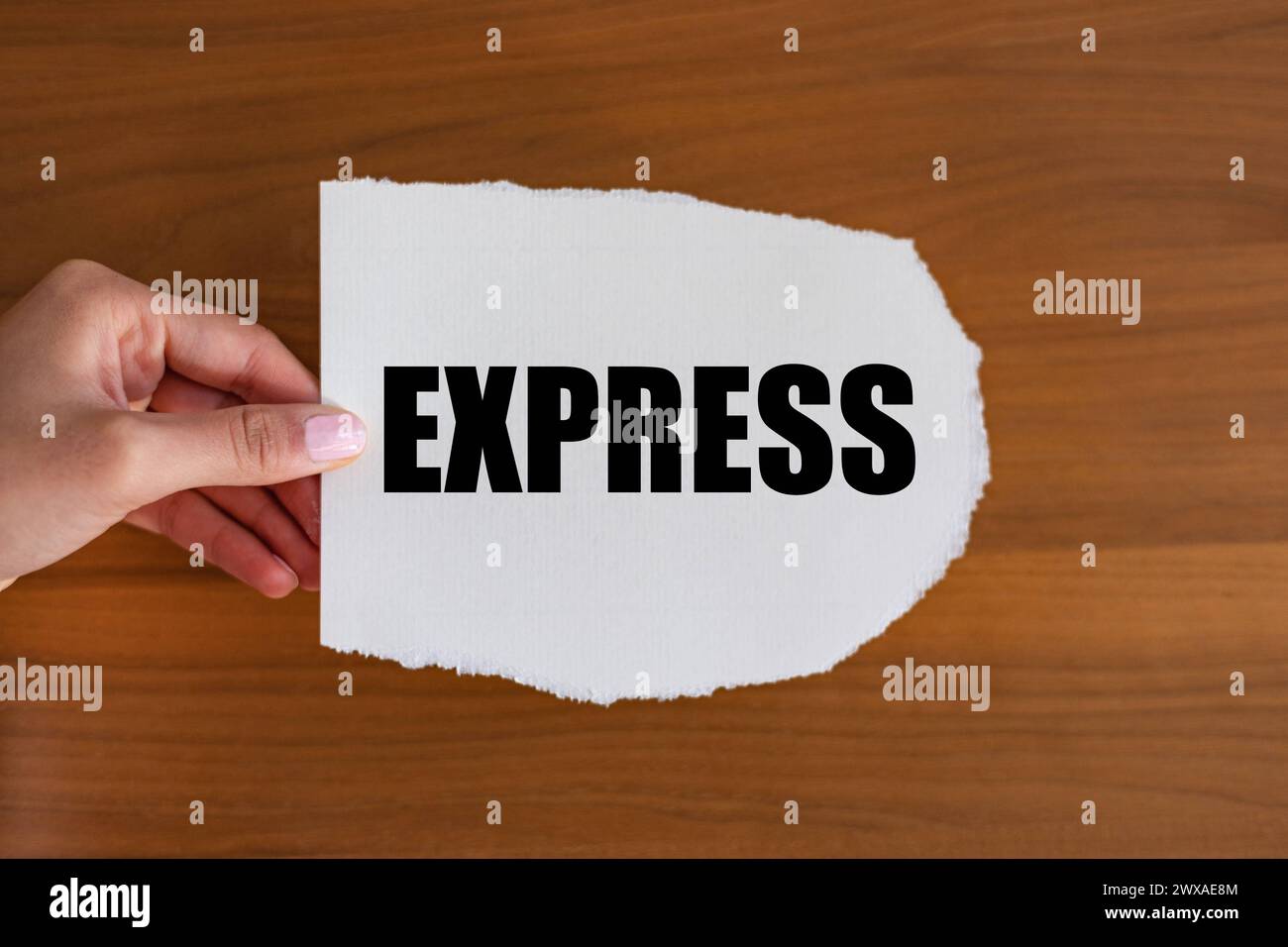 Express Express. Woman hand holds a piece of paper with a note, express. Transport, fast, urgency, delivering, parcel service. note B1983 express Stock Photo