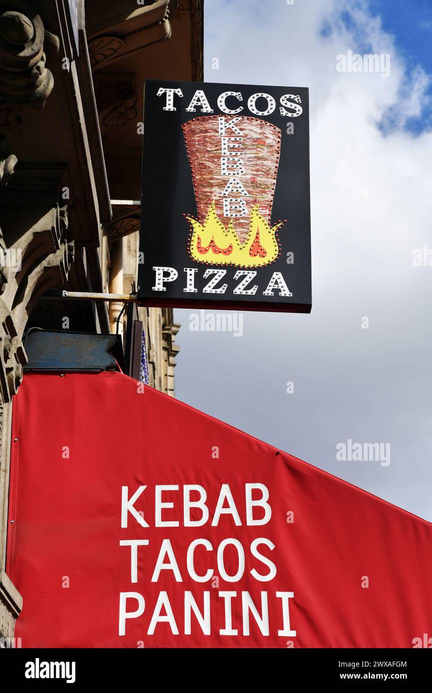 Tacos/Pizza/Kebab/Panini Restaurant sign, Paris - France Stock Photo