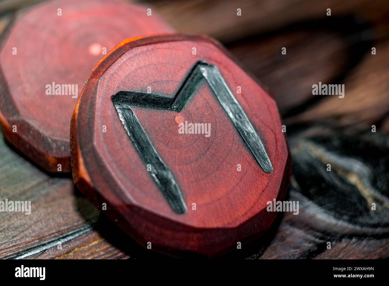Eoh Rune Rune Ehwaz red color carved from wood on a wooden background - Elder ...