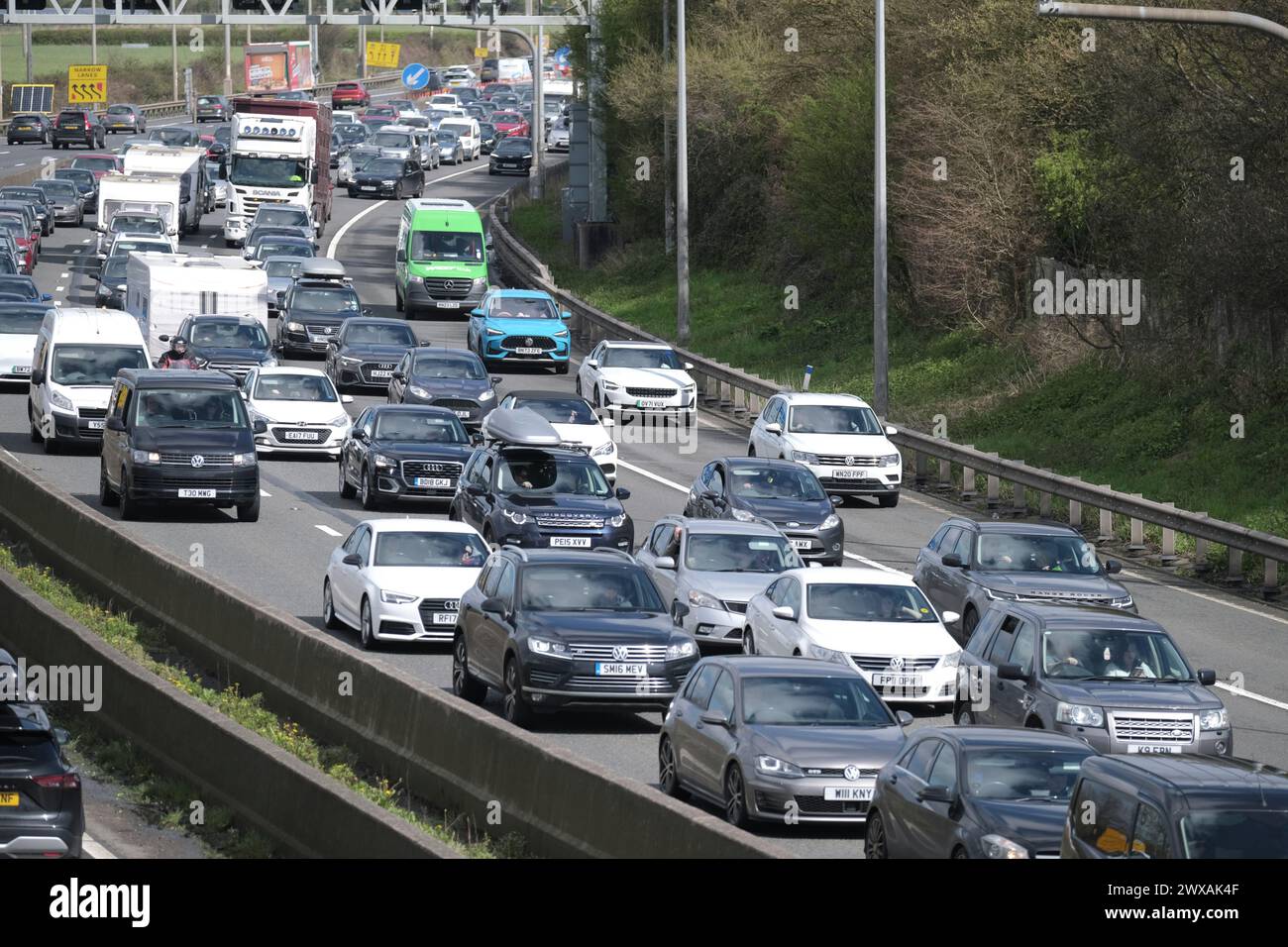 Bristol, UK. 29th Mar, 2024. Easter holiday causes traffic congestion on the M5 between junctions 15/16 and 17. Managed motorway speed restrictions are in place due to the volume of traffic heading south towards Devon and Cornwall. Highways England reports speeds in the low 20's. Credit: JMF News/Alamy Live News Stock Photo
