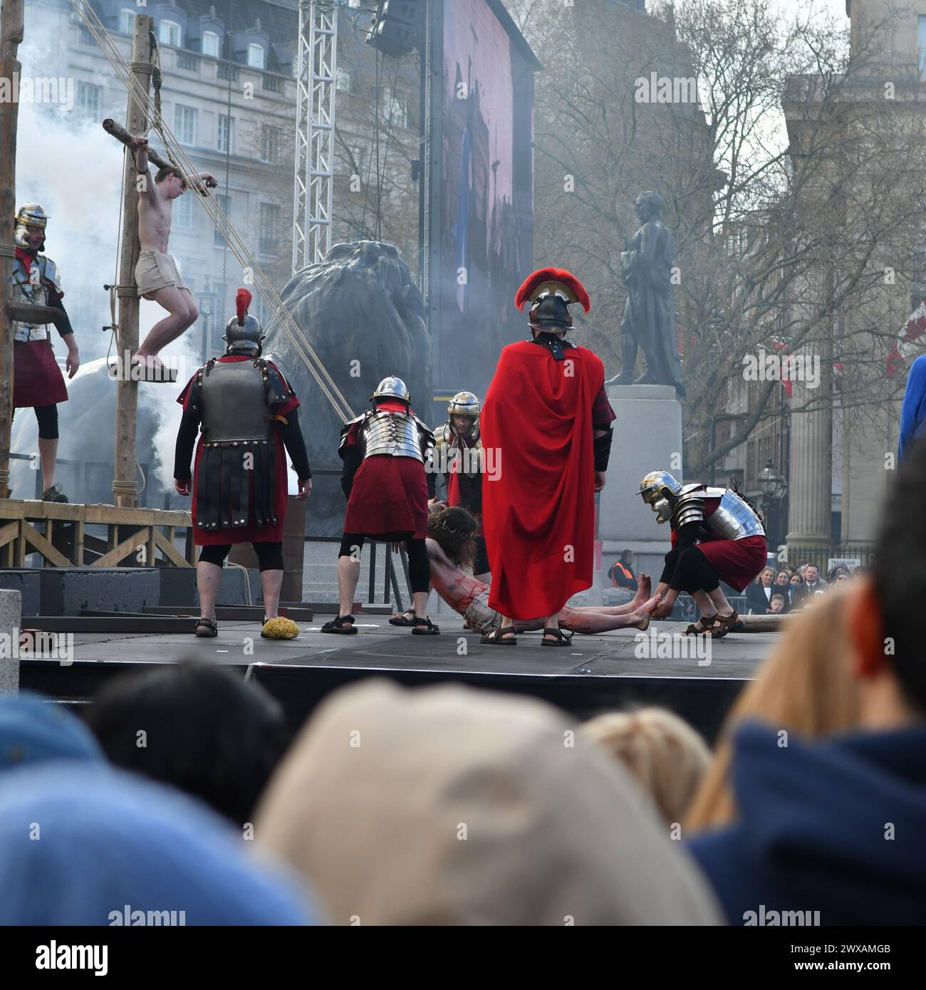 Westminster, London, UK, 29th March 2024. Crowds gather for Passion Play performance in Trafalgar Square on Good Friday as Christians celebrate Easter. The crucifixion. Paul Biggins/Alamy Live News Stock Photo