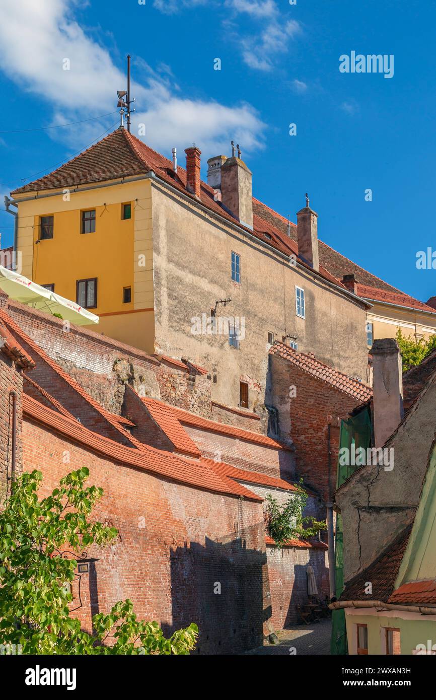 SIBIU, TRANSYLVANIA, ROMANIA - JULY 8, 2020: Old buildings and Stairs Passage, known as the Needle Wall,a passage which connected the Upper Town and t Stock Photo