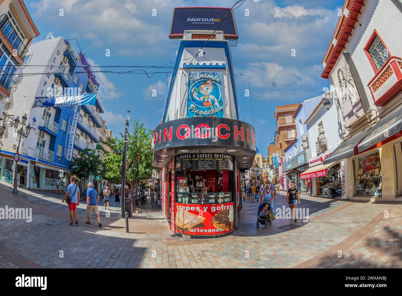 BENIDORM, SPAIN - AUGUST 13, 2020: View with small and picturesque street with tourists, located in the historical center of the city. Stock Photo