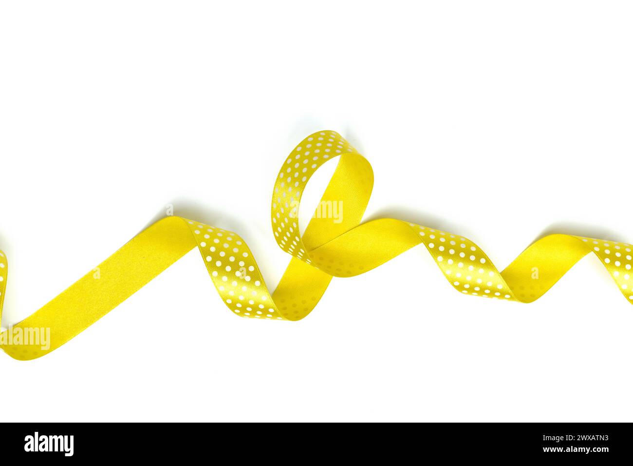Yellow Ribbon Spinning Yellow ribbons isolated on white Stock Photo - Alamy