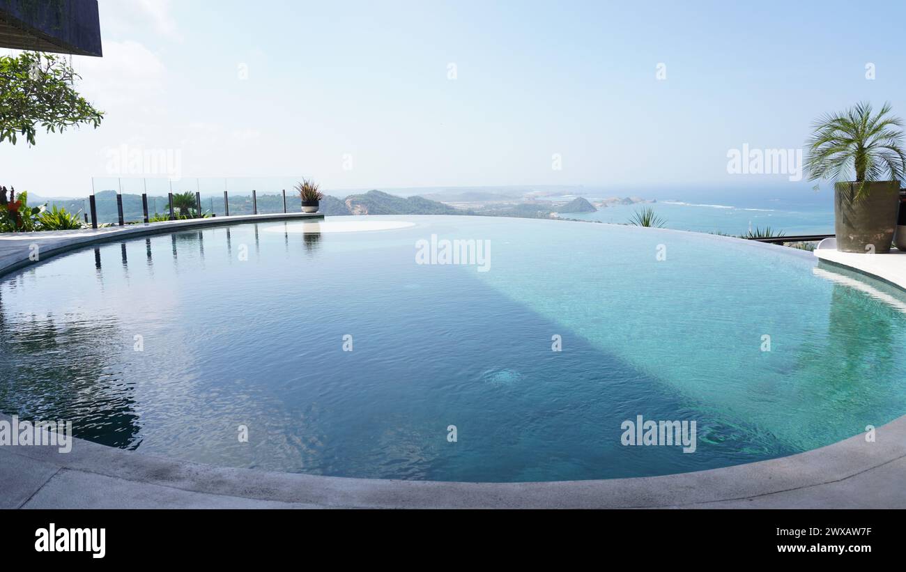 A swimming pool with seascape in Siwa Resorts, Lombok with tropical vibes Stock Photo
