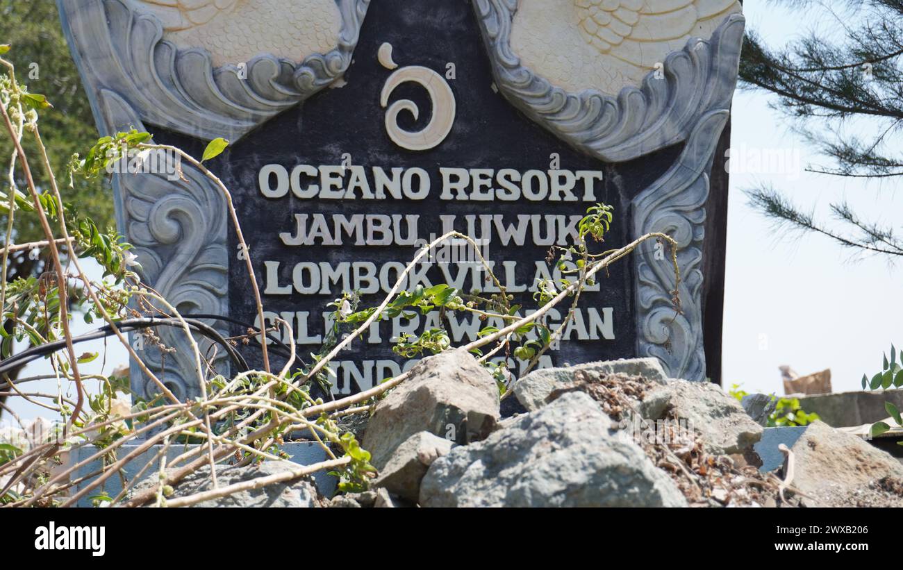 Sign of Oceano Resort Jambuluwuk Lombok Village Gili Trawangan Indonesia in a stone Stock Photo