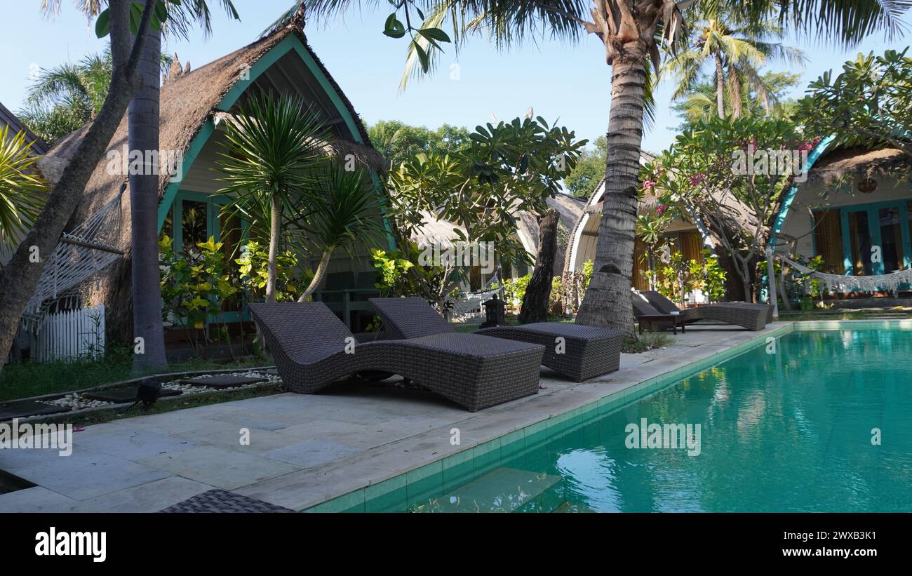 Relax by the pool at Gili Inlander Guest House on Gili Trawangan Lombok with hammock facilities Stock Photo