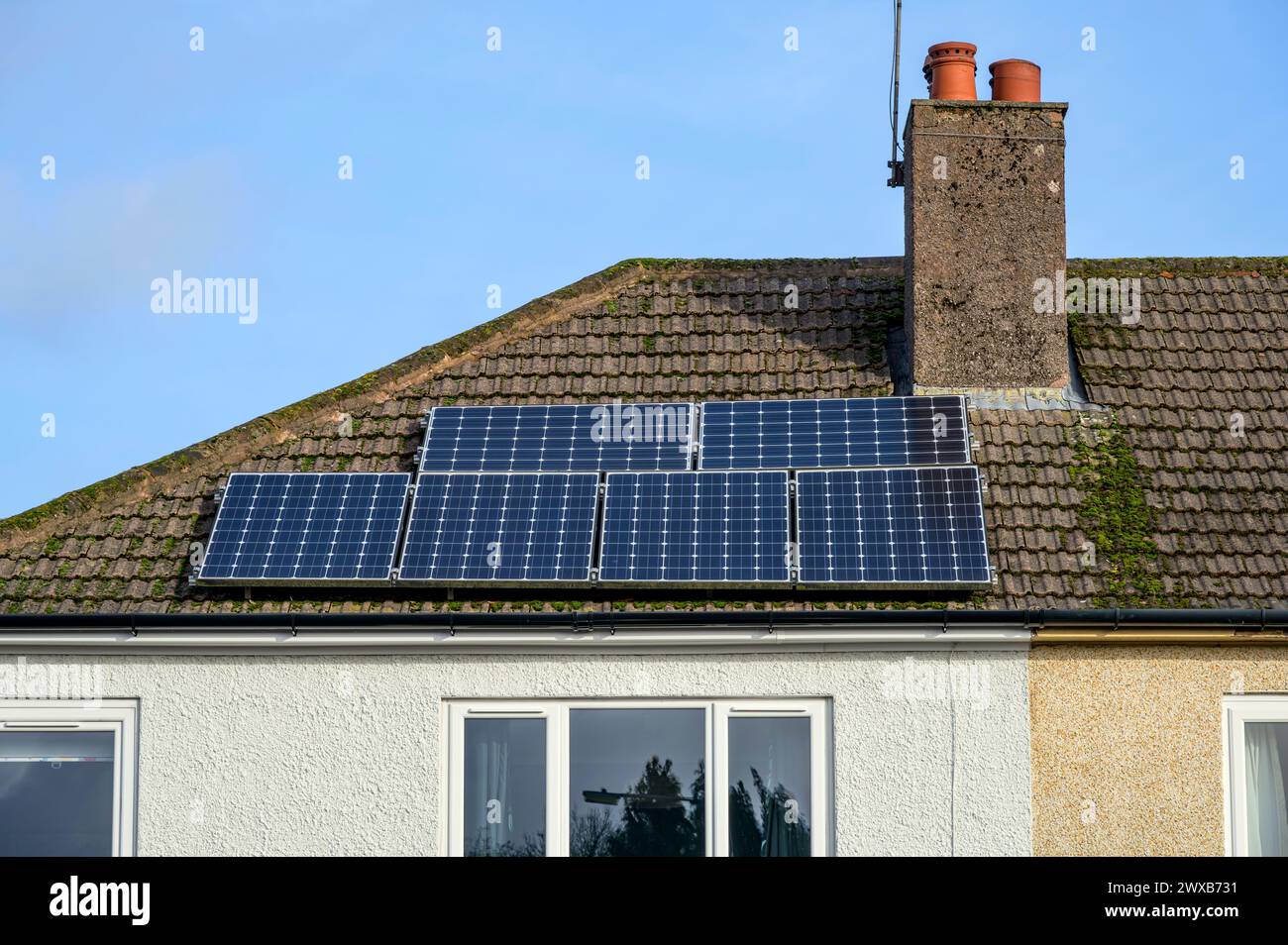 Solar panels retro fitted on the roof of an older house, Scotland, UK, Europe Stock Photo
