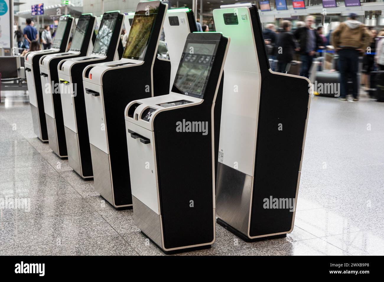 Frankfurt Airport, Germany - February 19, 2024: several self-service check-in automats at the Frankfurt International Airport Stock Photo
