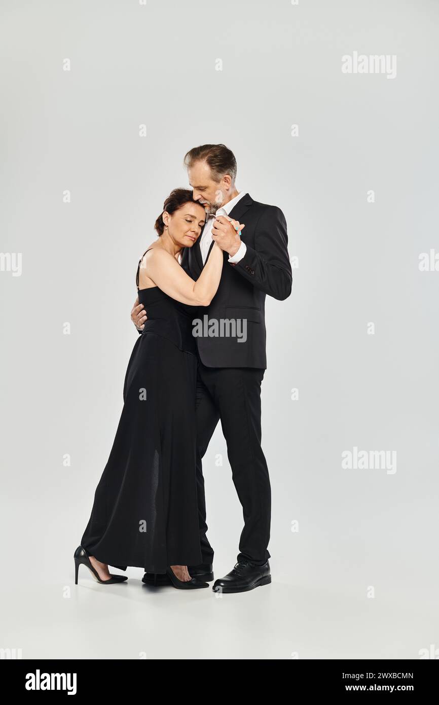 Full length shot of mature attractive couple in a tango dance pose ...