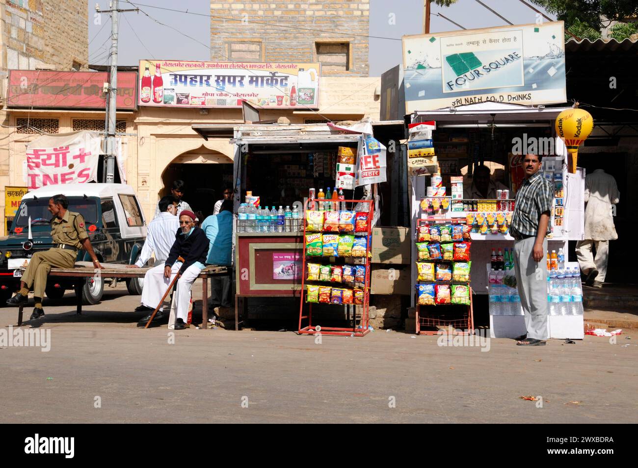 Market stalls and people on a busy street in the city centre, Jaisalmer, Rajasthan, North India, India Stock Photo