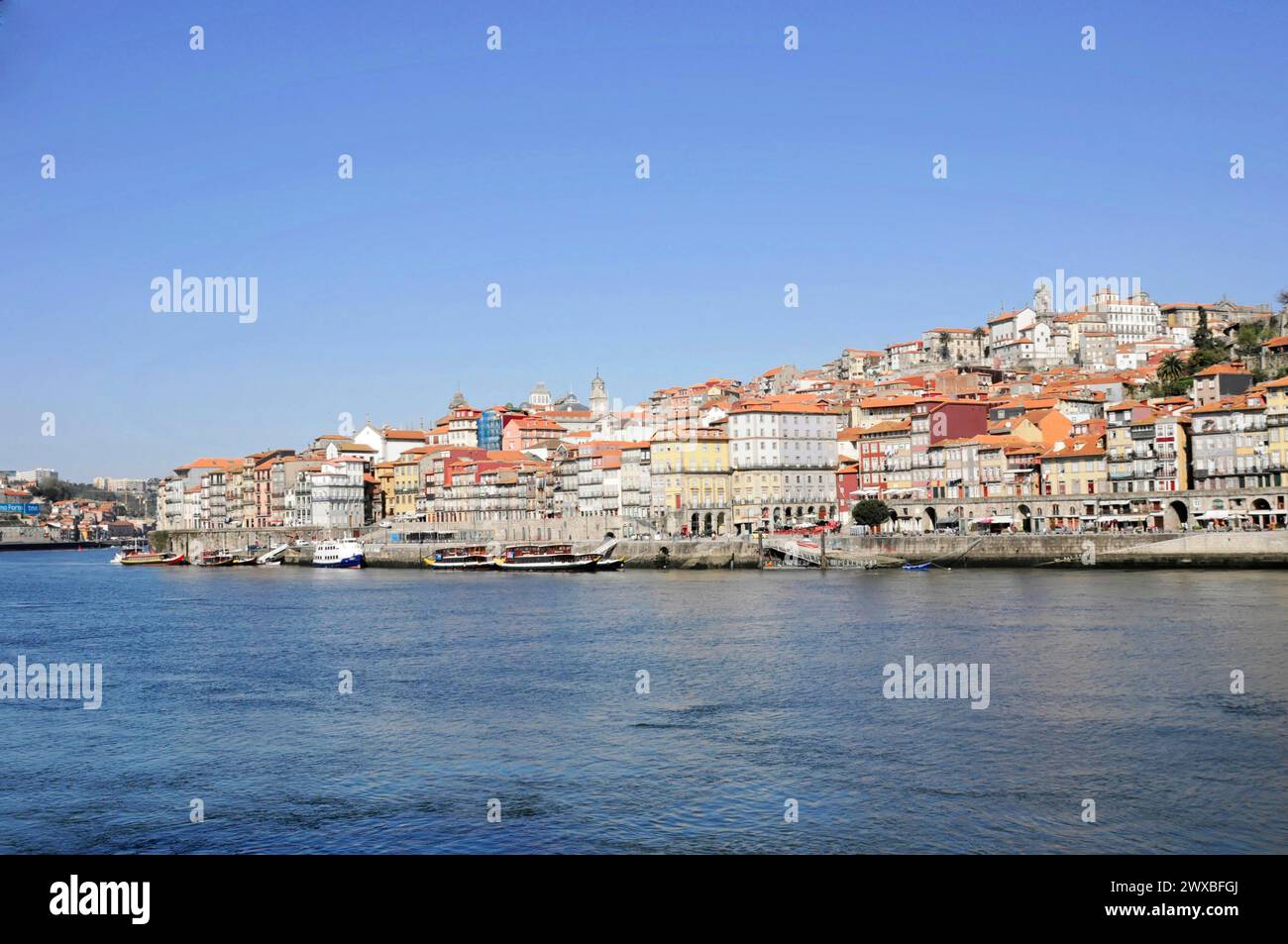 Sunny view of the historic riverside promenade of Porto on the Douro ...
